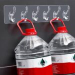 شريط تعليق جداري بلاستيكي شفاف متعدد الخطافات (Transparent Multi-Hook Wall Rack / Adhesive Wall Hanger).
