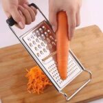 مبشرة خضروات يدوية مسطحة بمقبض من الستانلس ستيل (Stainless Steel Flat Handheld Vegetable Grater).